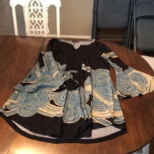 Black dress with tan and teal swirl design